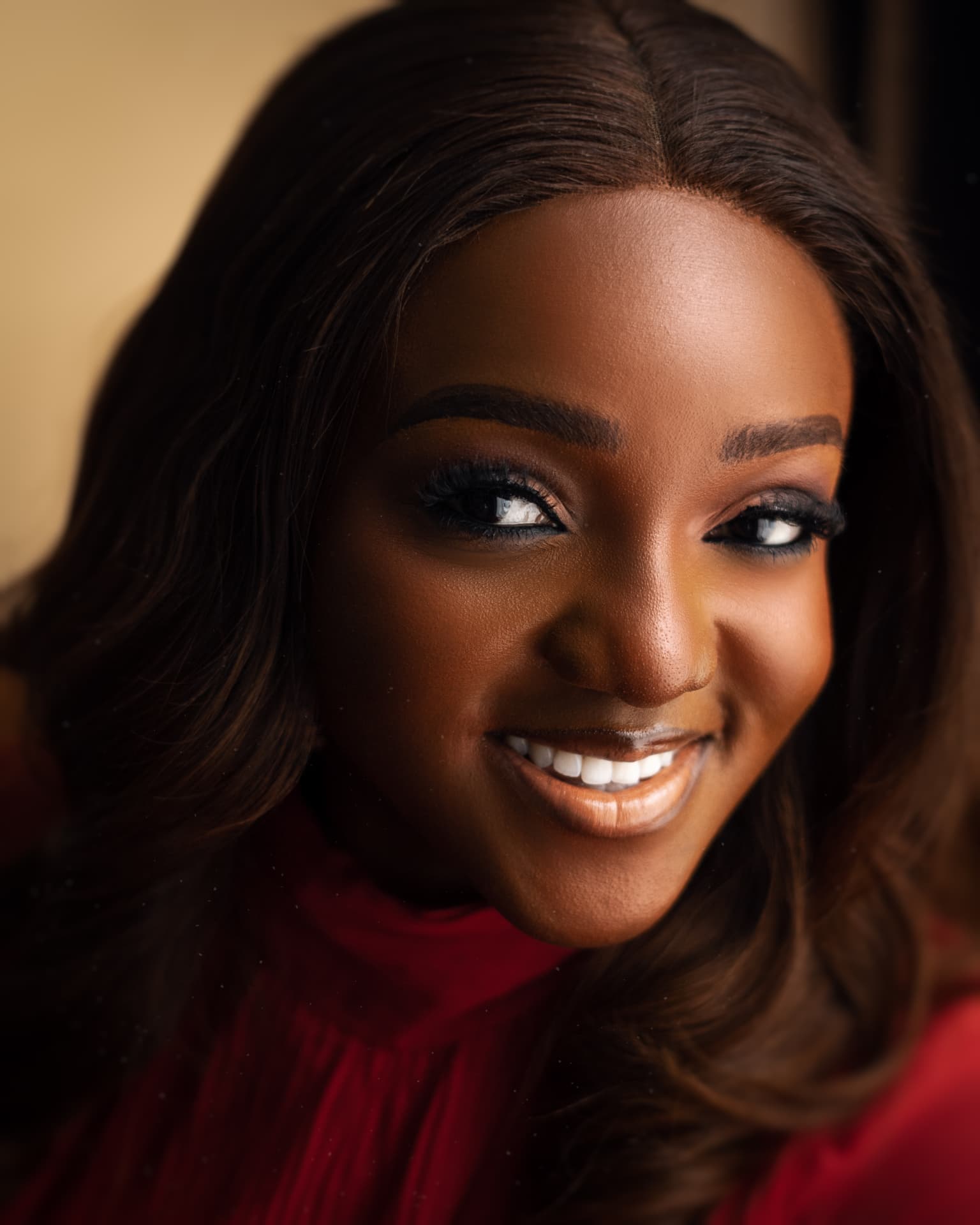 Close portrait of Ijidolapo Success Ijiwoye smiling.